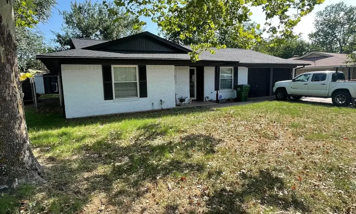 Professional roofing crew working on a residential roof in Charlotte